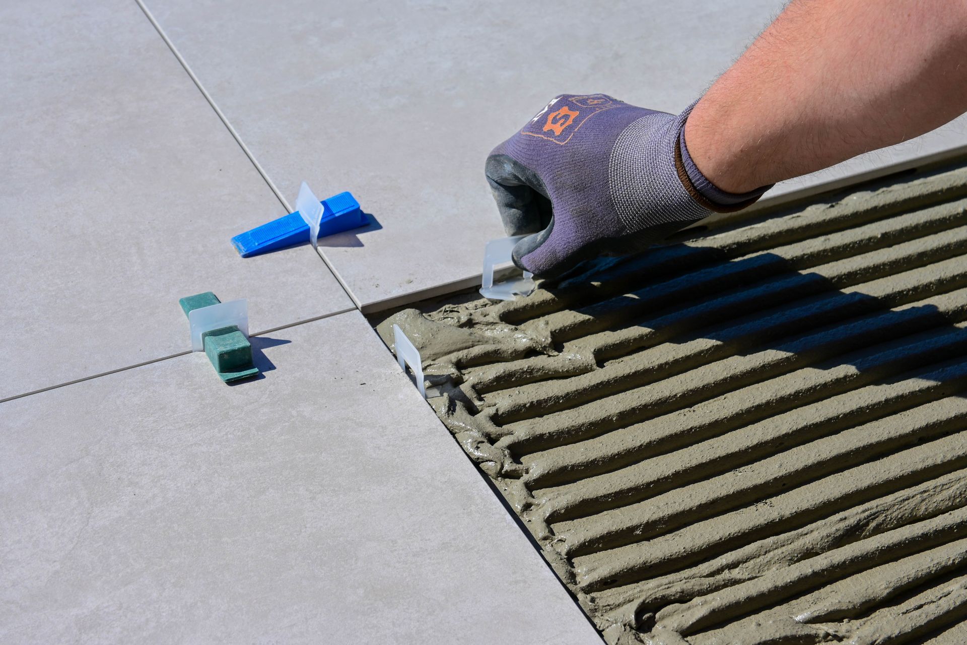 Floor tile being set with leveling clips