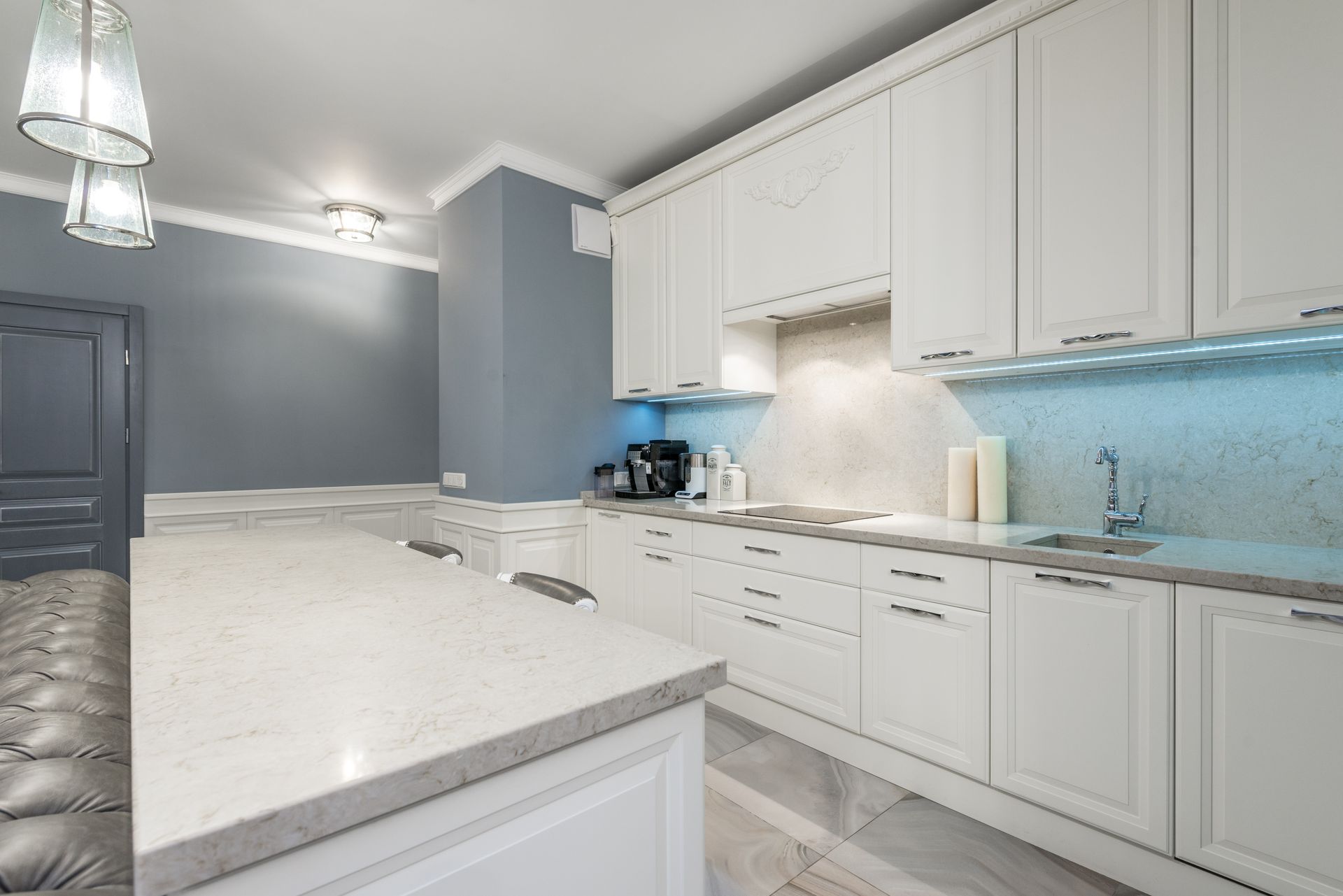 Kitchen with white cabinets and stone countertops